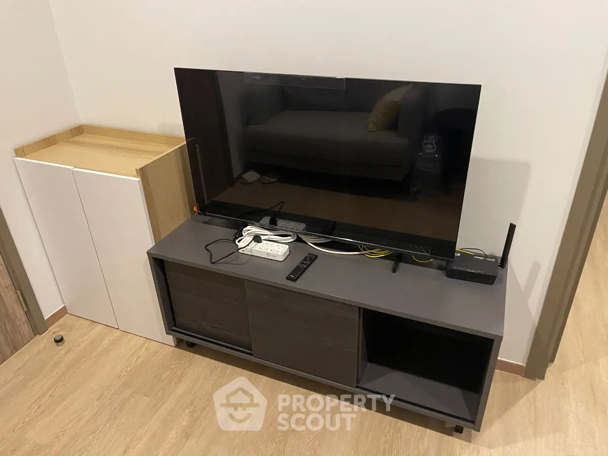 Modern living room with sleek TV stand and contemporary decor