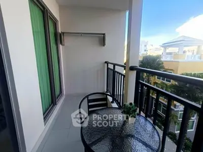 Charming balcony with seating and scenic view in modern apartment
