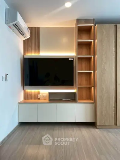 Modern living room with sleek TV unit and ambient lighting