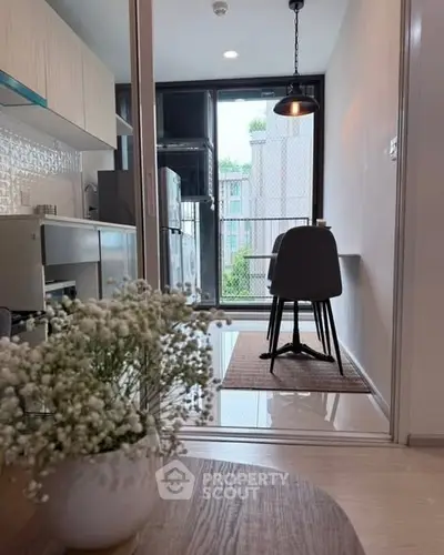 Modern kitchen with sleek design and dining area overlooking a scenic view, perfect for urban living.