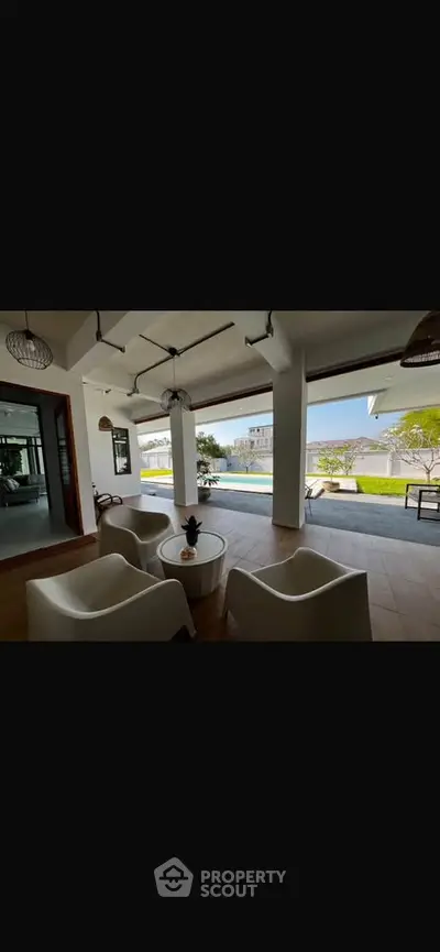 Luxurious open living area with pool and stunning view, perfect for relaxation and entertaining.
