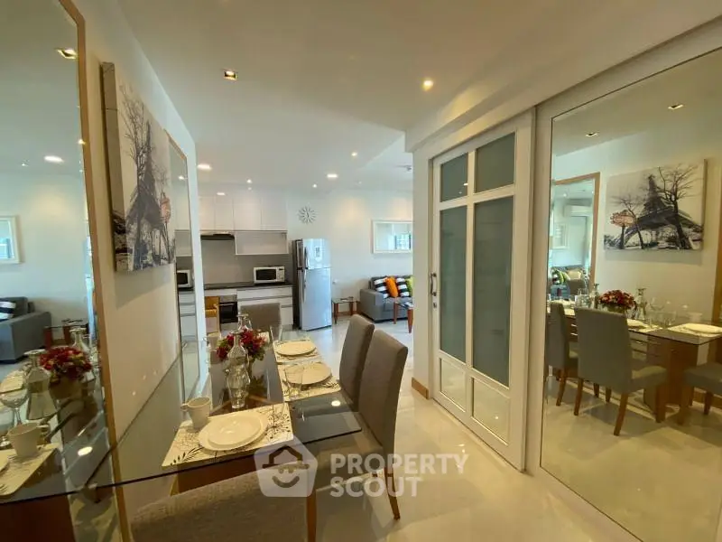 Modern open-plan living and dining area with stylish decor and ample natural light.