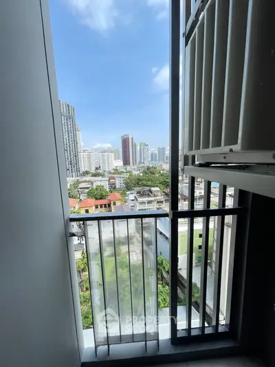 Stunning cityscape view from a modern balcony in a high-rise building.