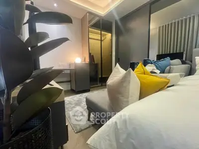 Modern bedroom with stylish decor and cozy ambiance, featuring plush pillows and elegant lighting.