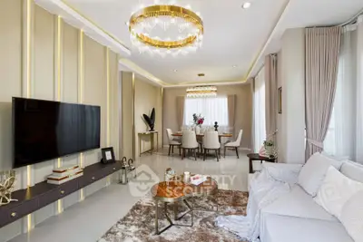 Luxurious living room with elegant decor and modern chandelier