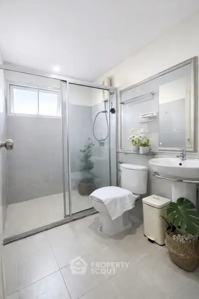 Modern bathroom with glass shower and elegant decor