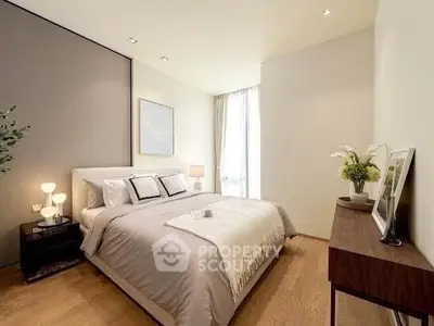Elegant bedroom with modern decor and natural light, featuring a cozy bed and stylish furnishings.