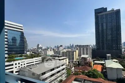 Stunning cityscape view from high-rise balcony showcasing urban skyline and modern architecture.