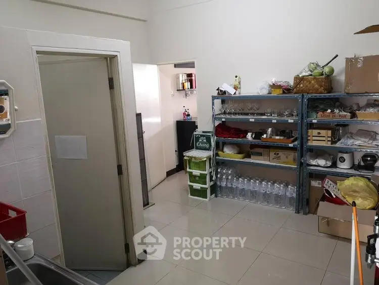 Spacious storage room with shelves and organized supplies in a modern property.