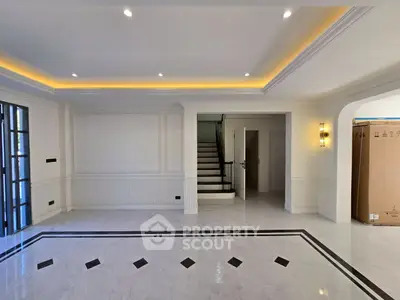 Luxurious living room with elegant marble flooring and modern lighting