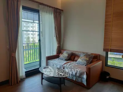 Cozy living room with balcony view, modern sofa and natural light