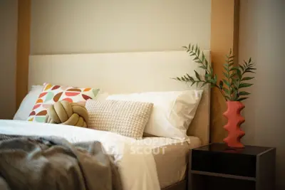 Stylish bedroom with modern decor and cozy bedding