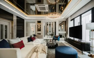 Luxurious modern living room with elegant decor and spacious seating area.