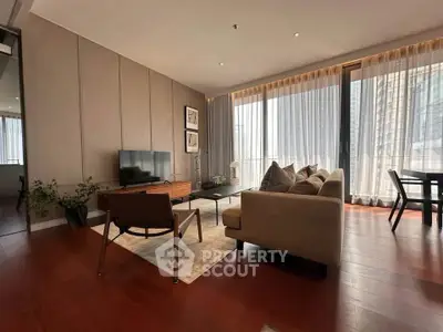 Spacious modern living room with large windows and elegant decor