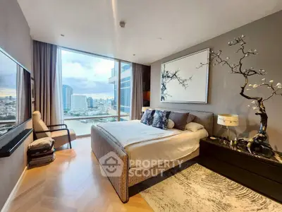 Luxurious bedroom with stunning city view, modern decor, and large window in high-rise apartment.