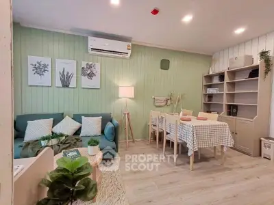 Charming living room with modern decor, cozy seating, and stylish dining area in a well-lit space.