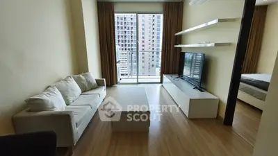 Modern living room with balcony view in high-rise apartment