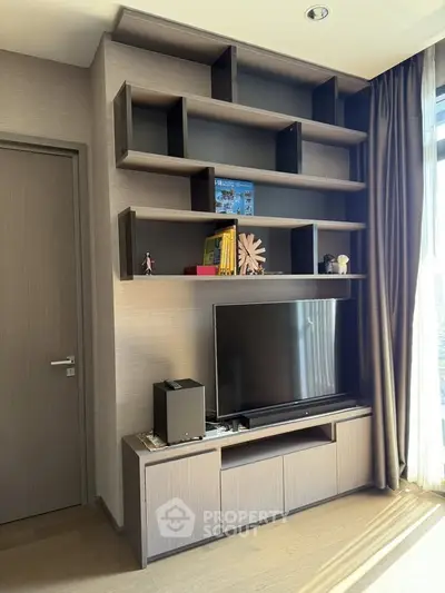 Modern living room with sleek TV unit and stylish shelving