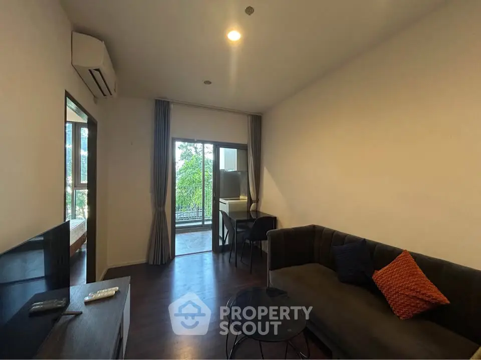 Cozy living room with modern furniture and balcony view