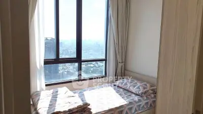 Cozy bedroom with stunning city view from large window