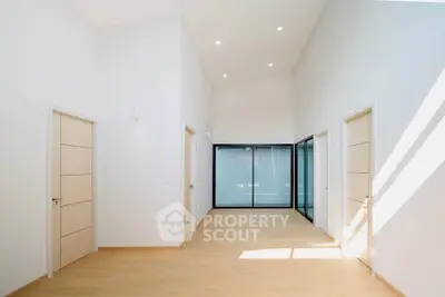 Spacious modern interior with high ceilings and natural light