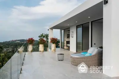 Luxurious modern balcony with stunning panoramic view and stylish outdoor seating.