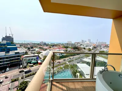 Stunning city and ocean view from high-rise balcony with jacuzzi