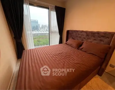 Cozy bedroom with city view and elegant brown bedding