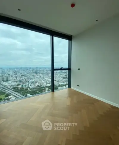 Stunning corner unit with panoramic city view and elegant wooden flooring.