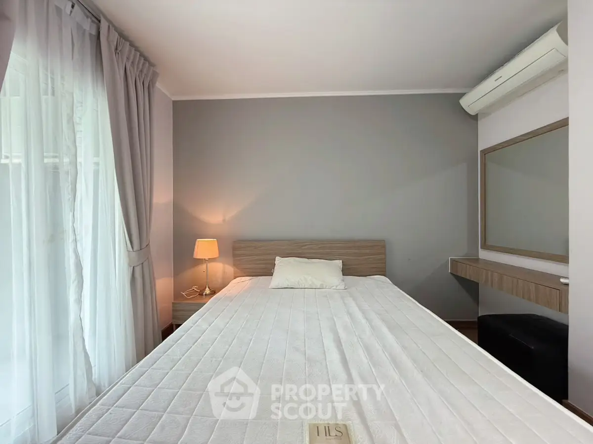 Cozy bedroom with modern decor and natural light