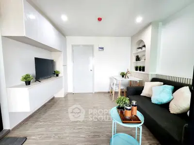 Modern living room with sleek design, cozy sofa, and stylish decor in a bright apartment.