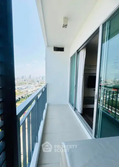 Spacious balcony with stunning city skyline view, perfect for relaxation and enjoying urban living.