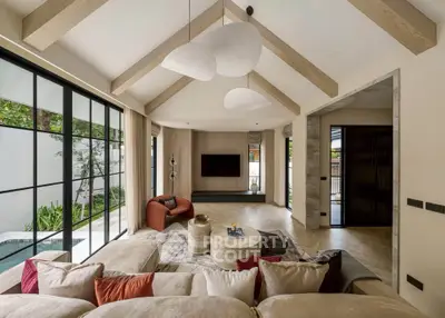 Luxurious living room with vaulted ceiling and modern decor