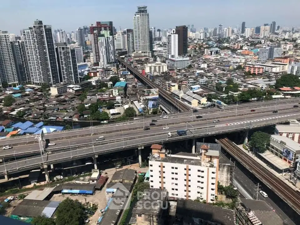 Stunning cityscape view showcasing urban skyline and highway infrastructure, perfect for real estate investment.