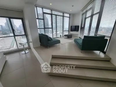 Modern living room with panoramic city views and stylish furniture