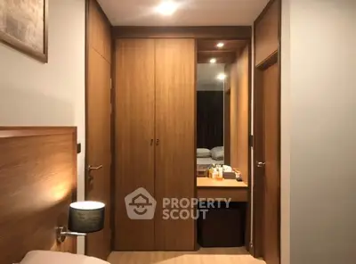 Cozy bedroom with wooden wardrobe and ambient lighting