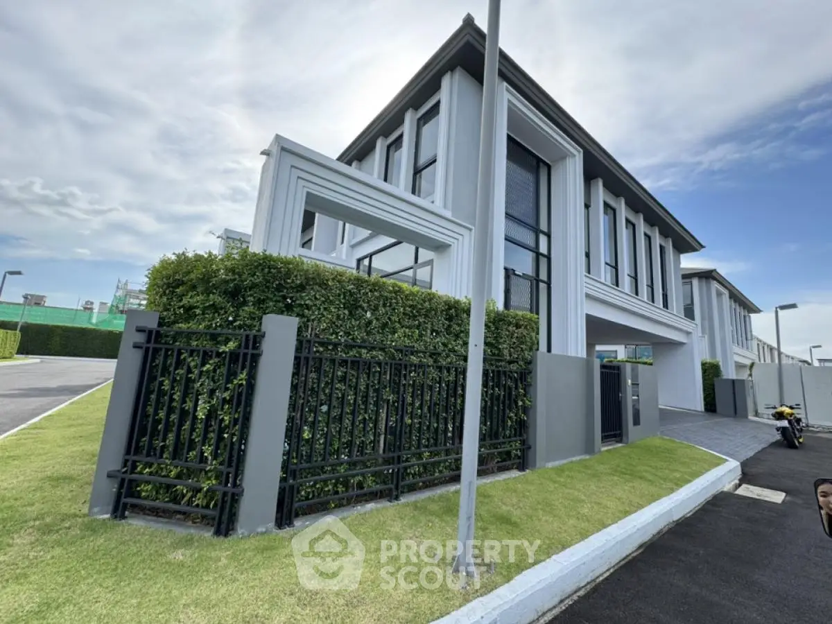 Modern luxury house exterior with sleek design and lush greenery
