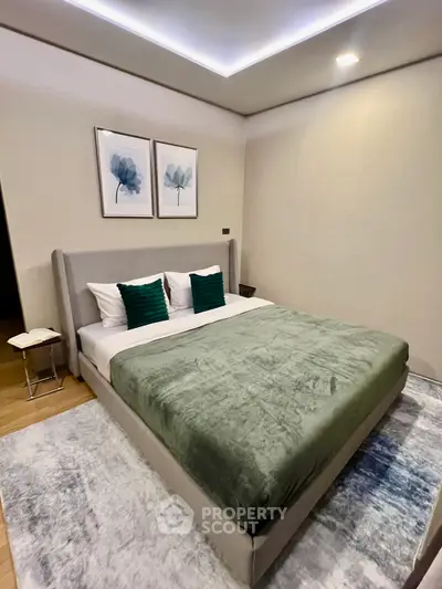 Luxurious bedroom with modern decor and plush bedding in a stylish apartment.