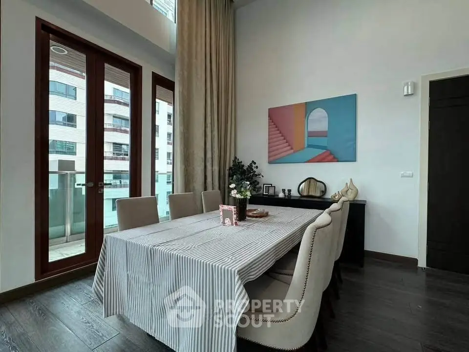 Elegant dining room with modern decor and large windows