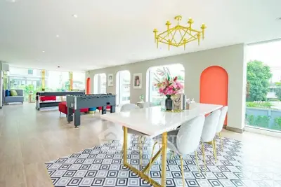 Spacious modern living room with elegant dining area and vibrant decor