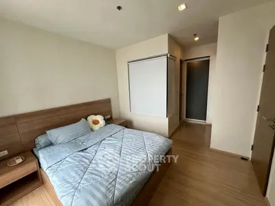 Modern bedroom with cozy wooden flooring and stylish decor