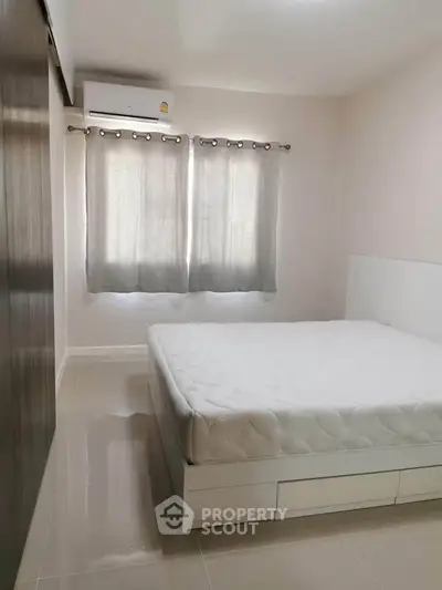Spacious bedroom with modern design and natural light