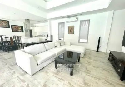 Spacious modern living room with open kitchen and elegant decor