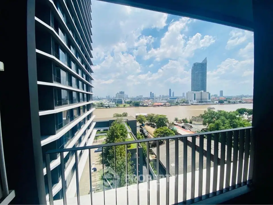 Stunning cityscape view from modern balcony overlooking river and skyline.