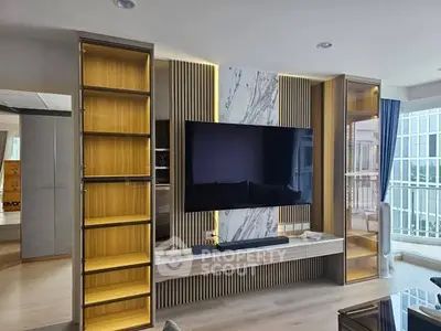 Modern living room with sleek TV unit and stylish shelving