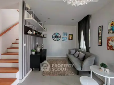 Stylish modern living room with cozy sofa and decorative wall art