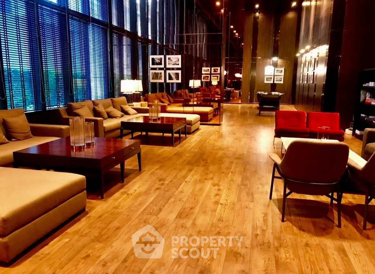 Luxurious modern living room with elegant wooden flooring and stylish furniture in a high-end apartment.