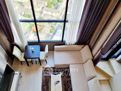 Stunning high-rise living room with panoramic city view and elegant decor