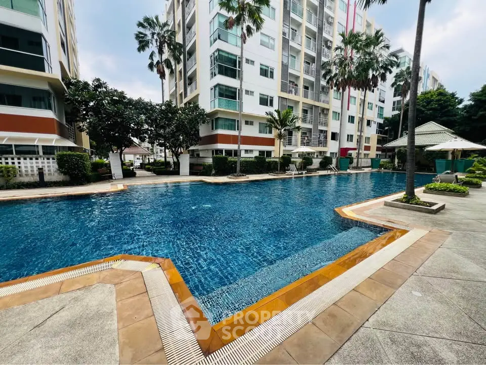 Luxurious apartment complex with stunning pool and lush landscaping