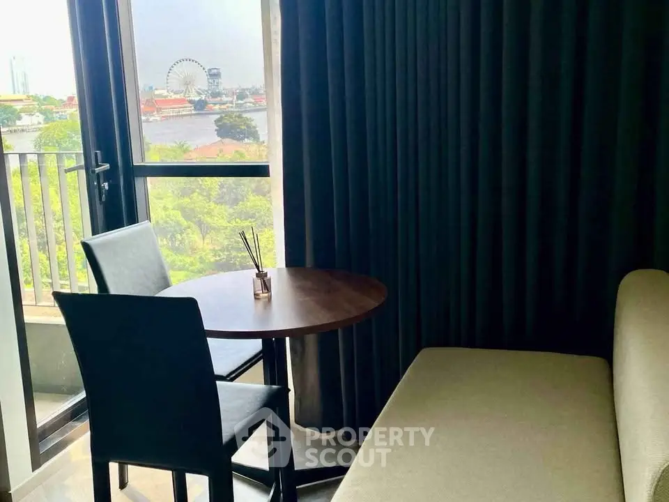 Cozy living room with balcony view and modern furniture, perfect for relaxation.